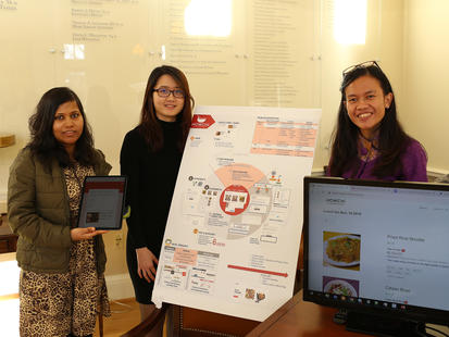 Students presenting at product design fair