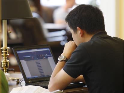 student in library