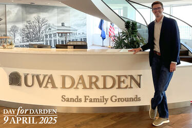 Jimmy Anthony standing at the UVA Darden Sands Family Grounds reception desk.