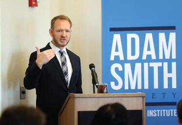 The Adam Smith Society Event Speaker at Podium